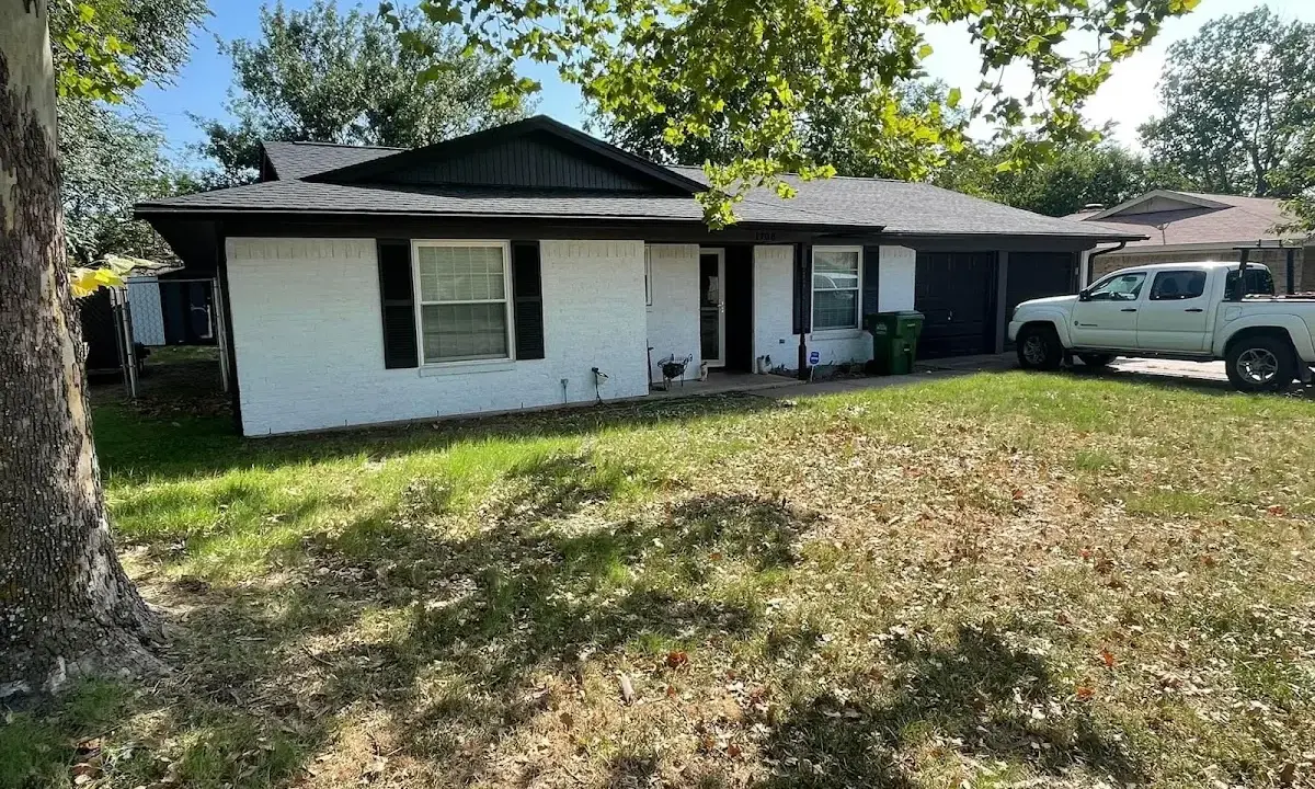 Professional roofing crew working on a residential roof in Green Oak